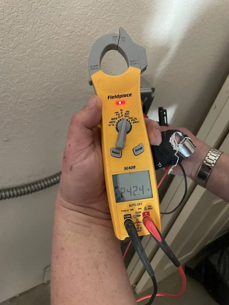 Voltage testing with clamp meter during Hot Tub / Pool Electrical Wiring in Bath